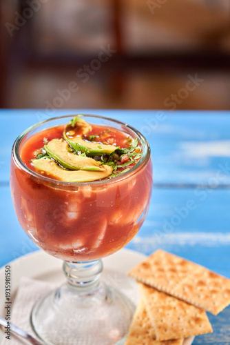 Mexican shrimp cocktail coctel de camarones with avocado and crackers