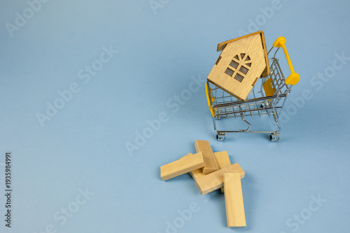 miniature home wobbling, petite residence collapsing with scattered wooden pieces, miniature structure destabilizing among scattered wooden blocks illustrating financial market fluctuations