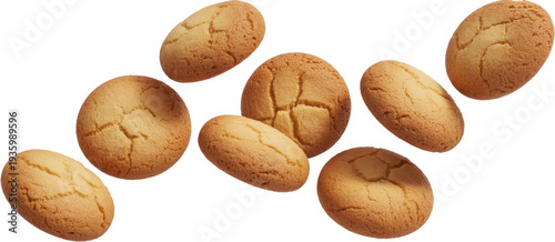 Eight whole golden brown cookies floating in air baked