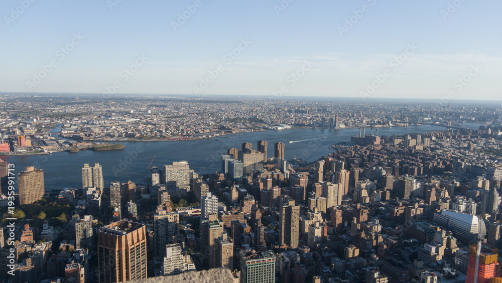 Fototapeta premium Aerial View of Manhattan with East River and Surrounding Boroughs