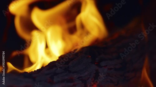 Slow motion flames in the fire box of a barbecue pit