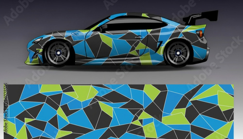 Sports car with a vibrant geometric camouflage wrap design in blue, green, and black, showcasing the full pattern below.