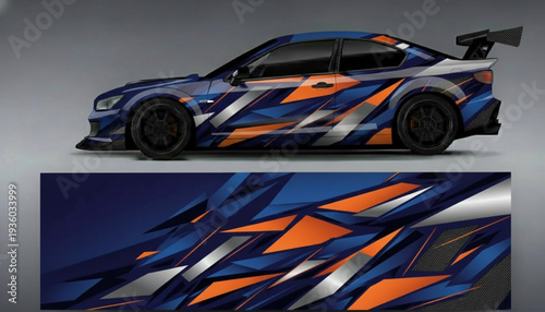A blue sports car with a dynamic geometric vinyl wrap design in orange, blue, and silver.