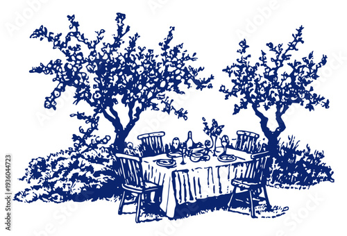 Elegant outdoor dinner table set between two blooming trees in a garden