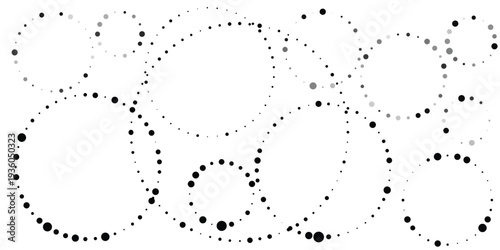 Scattered black dots form playful circular patterns on a white background, creating a whimsical abstract design or graphic element.