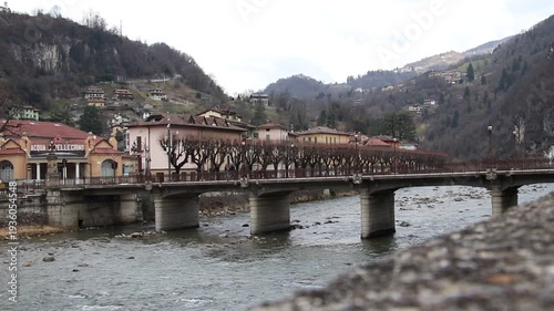 Historic stone bridge over the Brembo river in San Pellegrino Terme, Italy