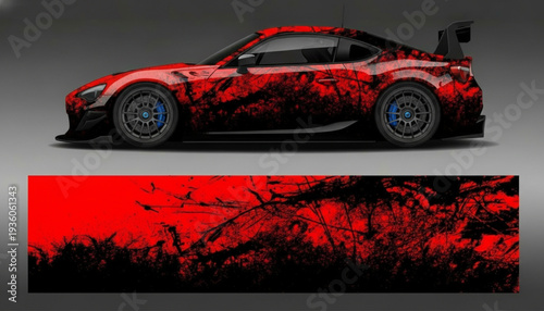 Red sports car with aggressive black grunge decal design.