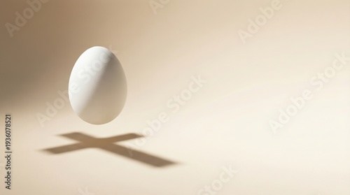 Floating white egg casting cross shadow religious Easter concept