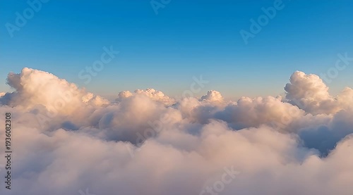 Magnificent view of fluffy clouds illuminated by sunlight against a clear blue sky