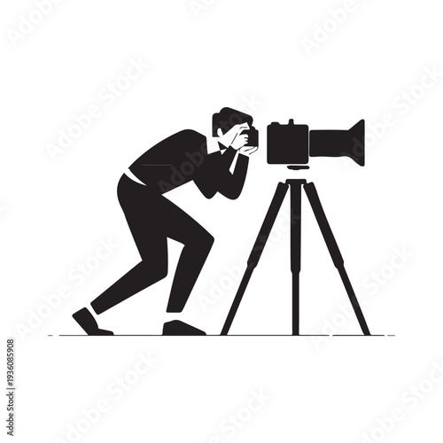 Professional Male Photographer Kneeling to Capture a Shot Using Camera and Tripod.