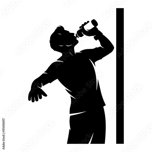 Silhouette of a soccer player drinking water during a break