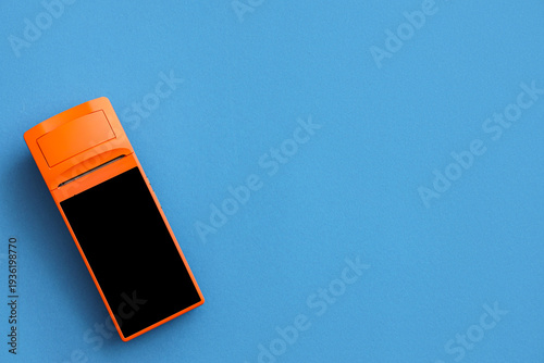Orange payment terminal on ...