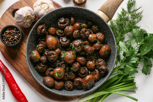 Frying pan with tasty fried...