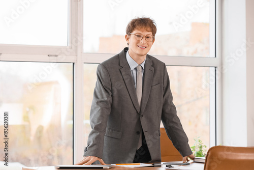 Young redhead businessman a...