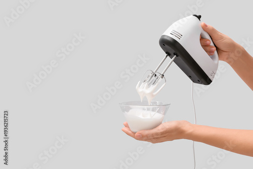 Female hands with electric ...