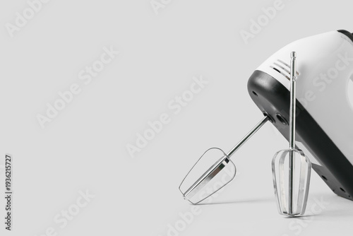 Electric mixer on grey back...