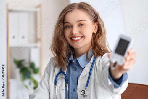 Female doctor with glucomet...