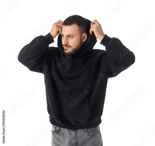Young man in black hoodie o...