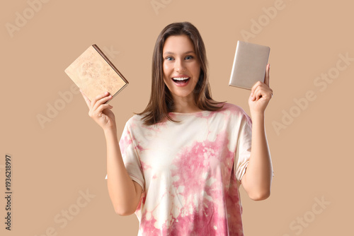 Young woman with notebooks ...