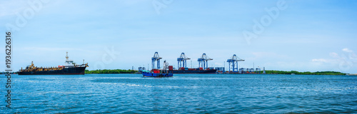 Panoramic sea view, cargo container ship and cityscapes of Kerala, India.