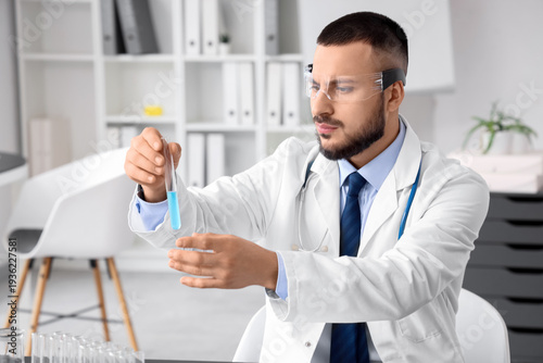 Male doctor in AR glasses w...