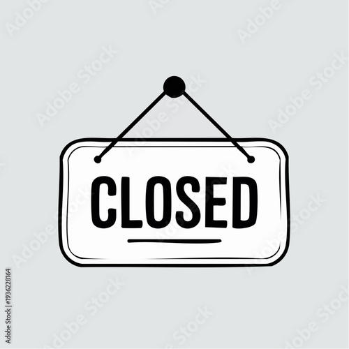 Closed sign hanging on a door or wall, indicating business is not open.