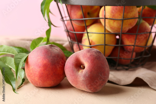 Basket and fresh peaches on...