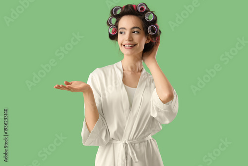 Young woman in robe with ha...