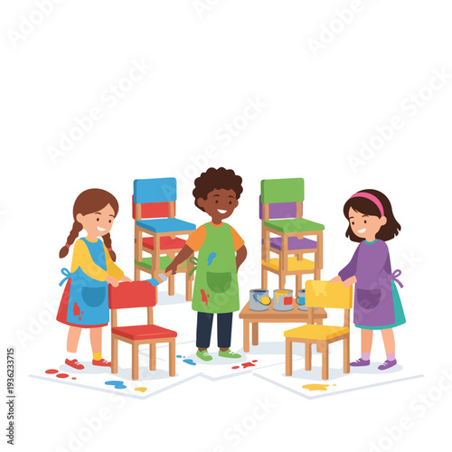 Three diverse children wearing aprons are happily painting wooden chairs in vibrant colors, with paint splatters showing on their clothes and the floor.