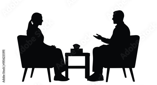 Silhouette of two people in chairs facing each other with a small table