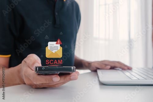 A man receives a malicious or scam message on his smartphone. Phishing, scam, or spam alert.