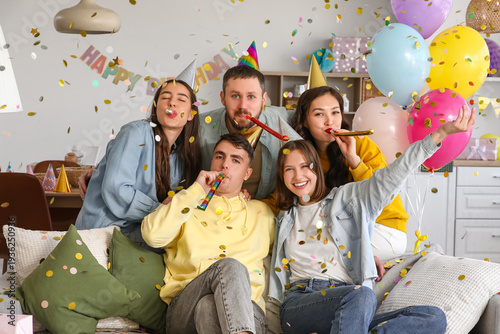 Group of young friends with...