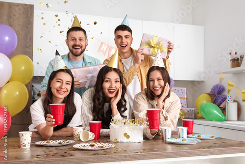 Group of young friends with...