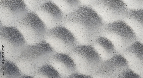 Sculpted sand ripple texture with repeating desert dune wave pattern and warm beige tones forming elegant minimalist abstract background ideal for graphic resources and architectural visualization