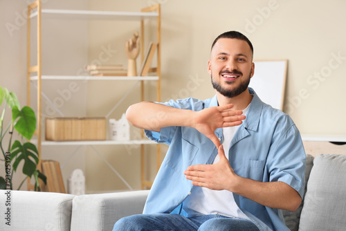 Young mute man using sign l...