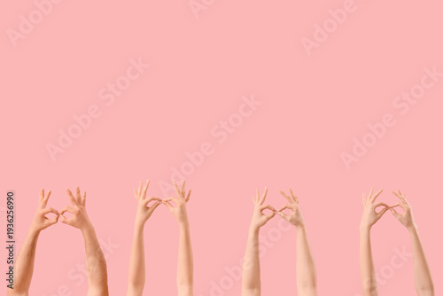 Many hands gesturing on pin...