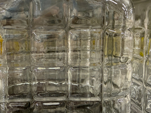A close up of a glass object with a yellow stripe
