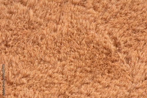 Fotografie brown plush fabric texture background, background of soft warm material
