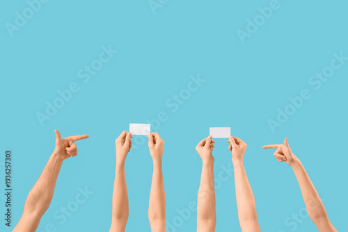 Many hands pointing at blan...