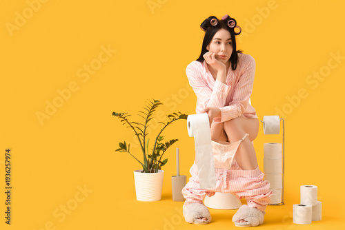 Young woman in pajamas with...