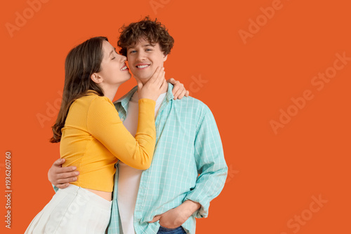 Young woman kissing her boy...