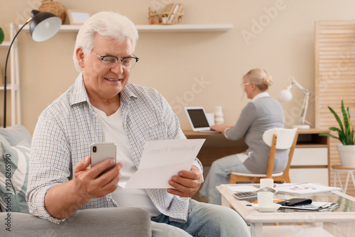 Senior man with refund form...