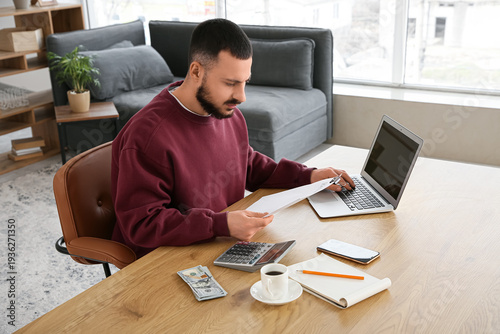 Young man with refund form ...