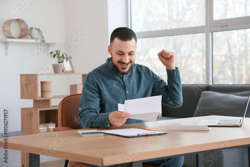 Happy young man with refund...