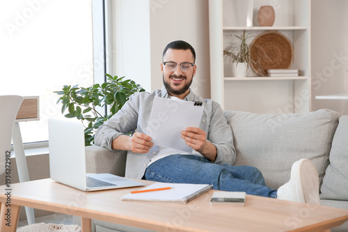 Young man with refund form ...