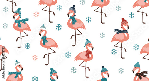 Winter themed seamless pattern of pink flamingos wearing cozy hats and scarves with snowflakes on a white background for holiday.