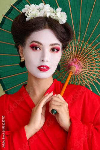 Beautiful young geisha with...