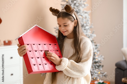 Cute happy little girl in d...