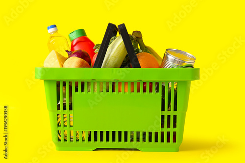 Green shopping basket full ...