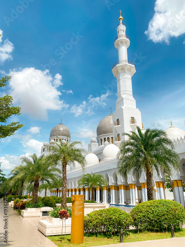 Solo, Central Java, Indonesia - January 3, 2026 - Beautiful view of Sheikh Zayed Grand Mosque Solo on a sunny morning with blue sky in the background.